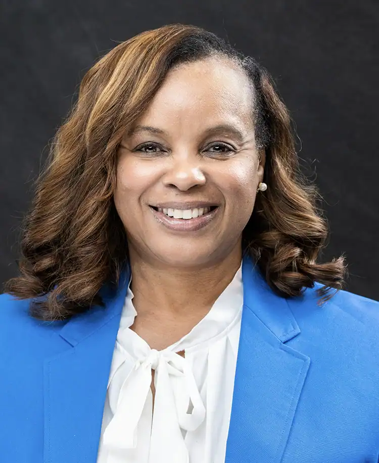 Margo Jackson smiling at EPI Center, professional portrait.