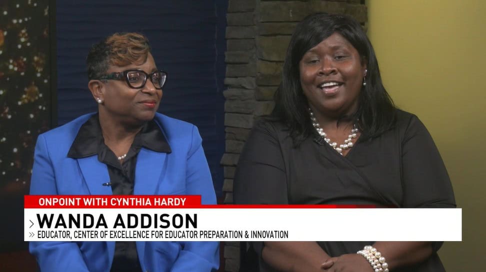 Two women discussing success in educator certification interview.