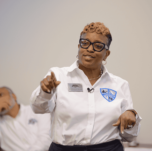 Professional woman speaking at EPI Center career event.